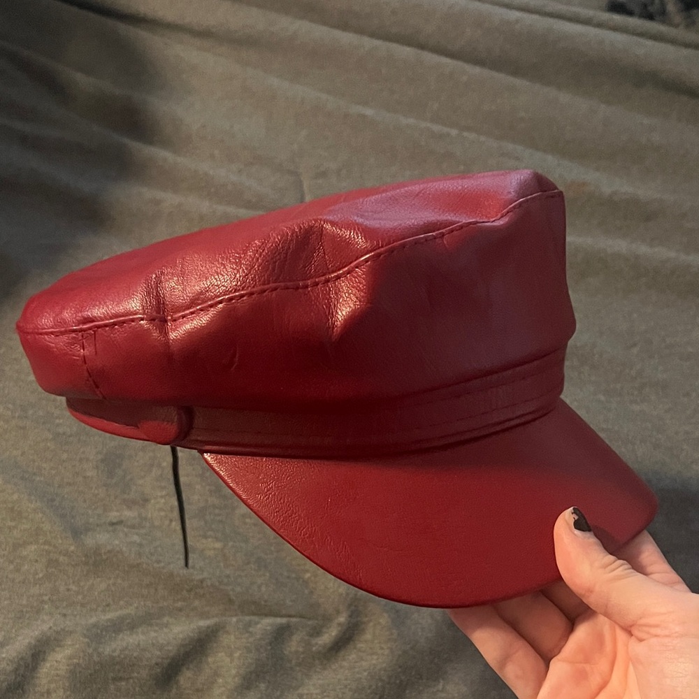 red faux leather cap